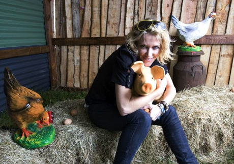 Cerys Matthews and model piglet friend at Glastonbury Festival