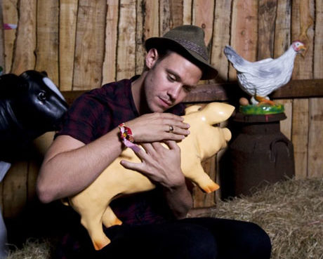 Will Young cradles model piglet at Glastonbury Festival