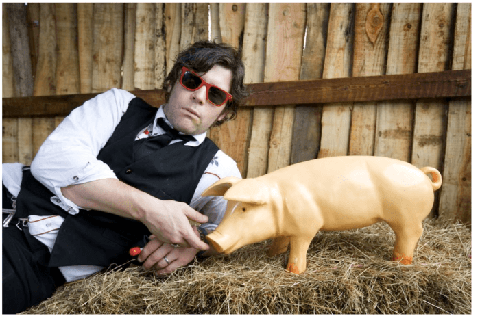 Ed Harcourt and piglet model at Glastonbury