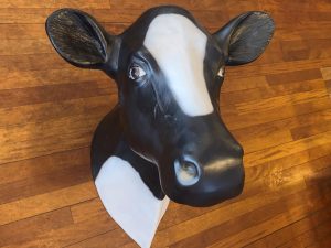 High‑detail life‑size cow head model with realistic contours and textured finish.