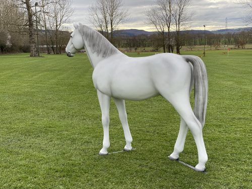 Grey life‑size fibreglass riding pony model standing in a natural pose.